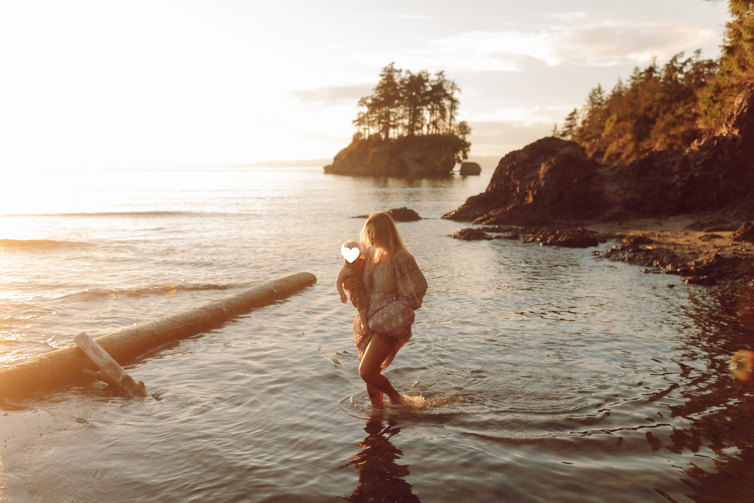 mom walking across water in olympic national park