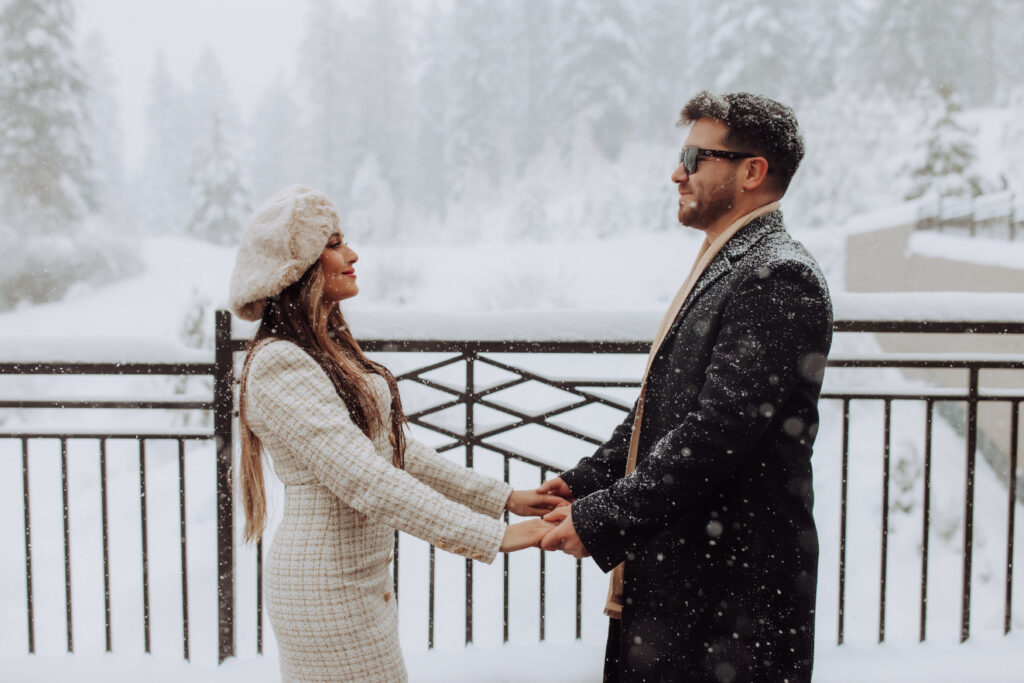 couple in front of a snowy backdrop at tamarack resort
