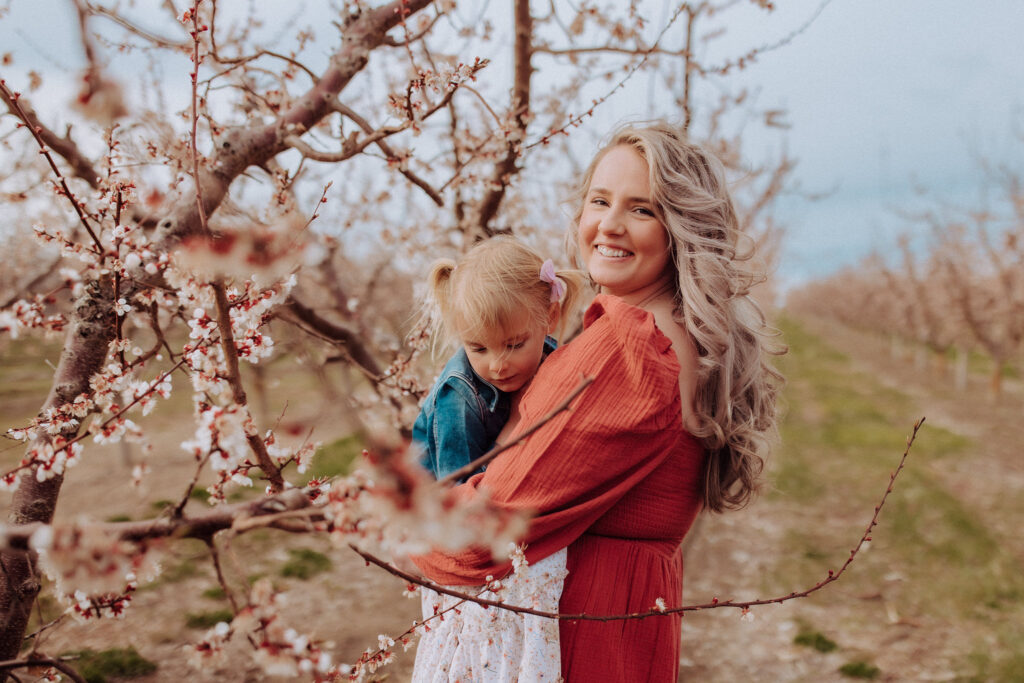 mom and daughter in cheery hill cherry blossoms in nampa